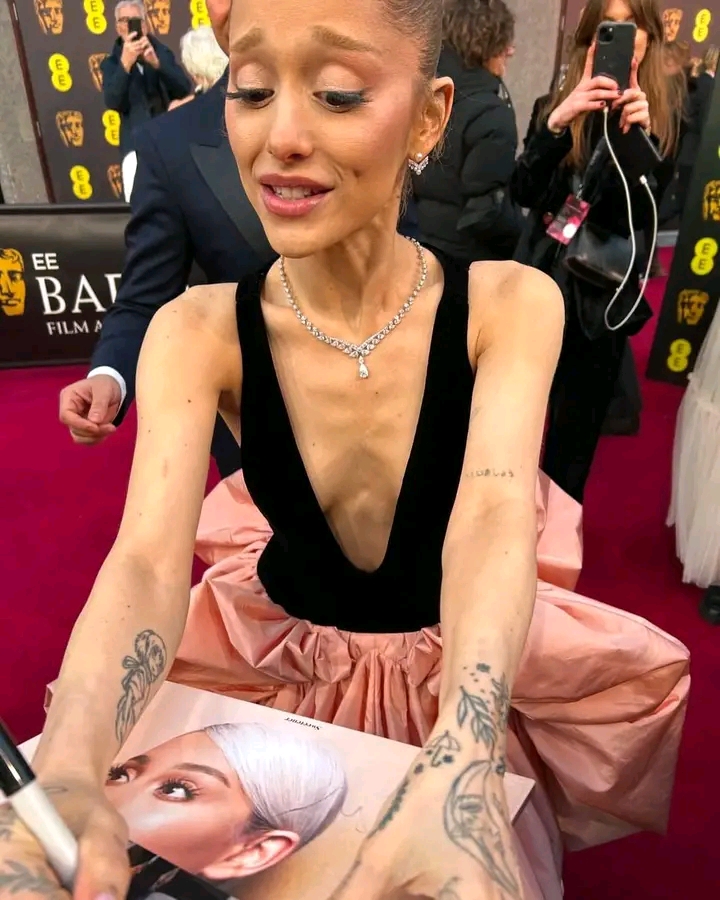 Ariana Grande, 31, Exposed for Why She Looks Unhealthily Thin After a Recent Viral Photo of Her Seeing and Signing a Fan’s Old Meet-and-Greet Picture at the EE BAFTAs Sparks Concern - Not Only Is She on a Vegan Diet, She’s Also Addicted to… 👇👇👇